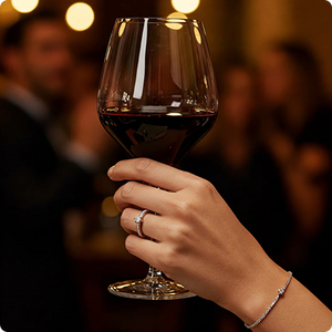 Hand with wine glass and jewelry